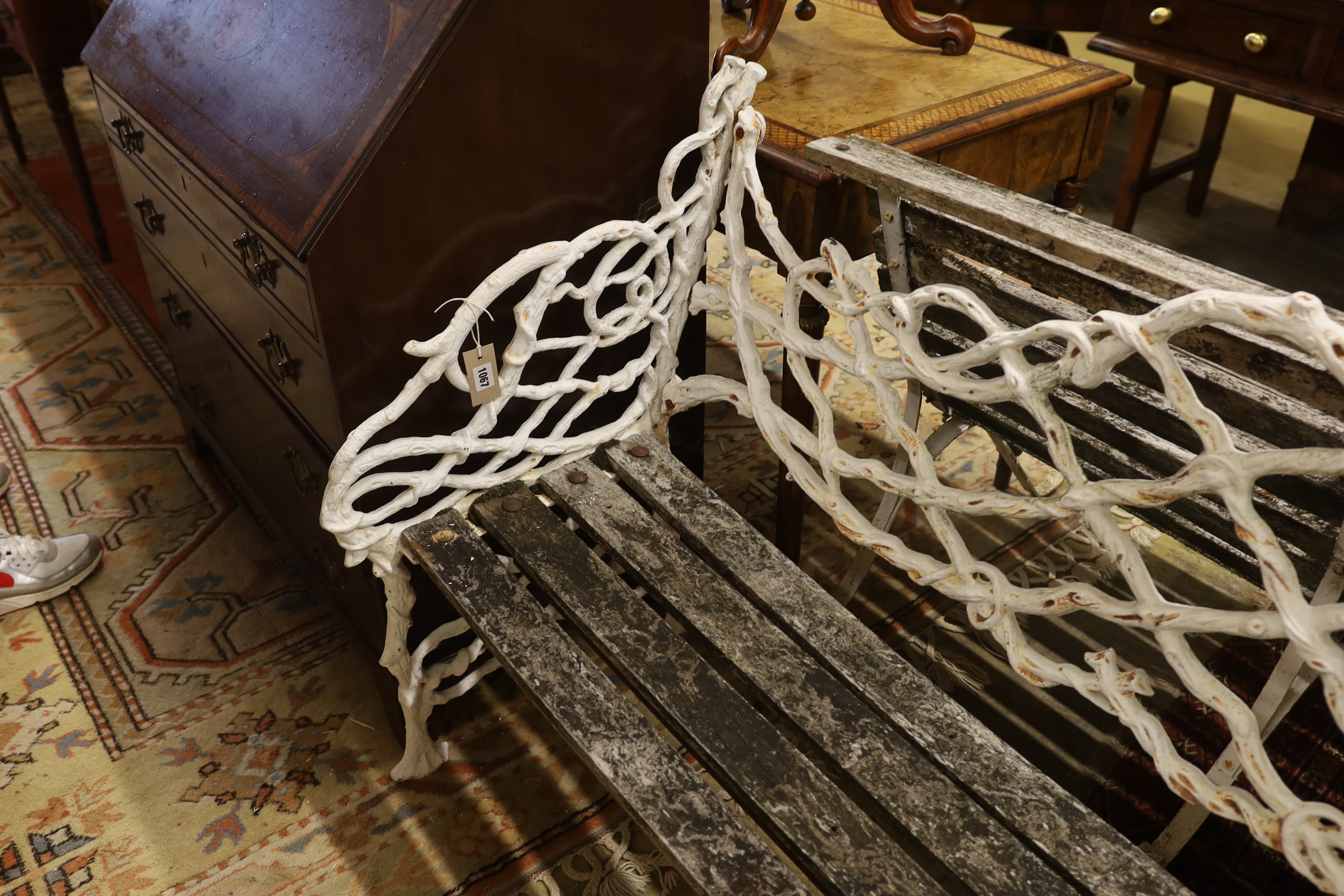 A Victorian Coalbrookdale design painted cast iron garden bench, length 138cm, depth 55cm, height 86cm